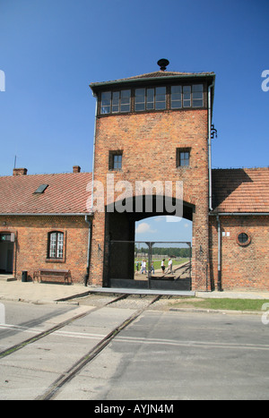 The archway and main SS guard house viewed from outside the camp at the former Nazi concentration camp at Auschwitz Birkenau. Stock Photo