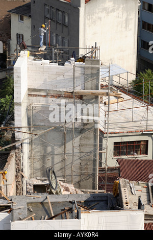 Construction worker working on high building. Galata, Beyoglu, Istanbul, Turkey Stock Photo