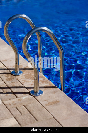 Swimming pool and ladder railings Stock Photo