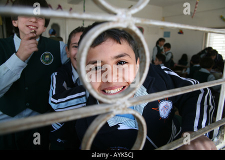 Many Iraqi refugees have settled in Amman Jordan and their children go to school there because of the ongoing violence in their Stock Photo