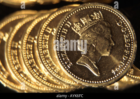 Five one pound UK coins on edge overlapping close up Stock Photo