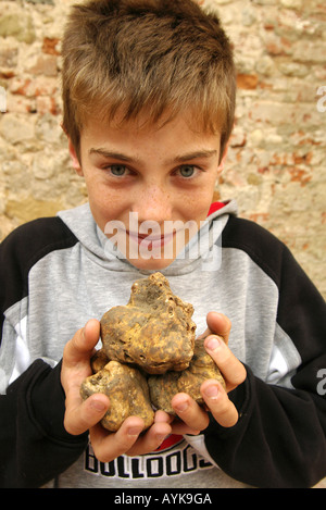Boy with white truffles upright vertical portrait Stock Photo