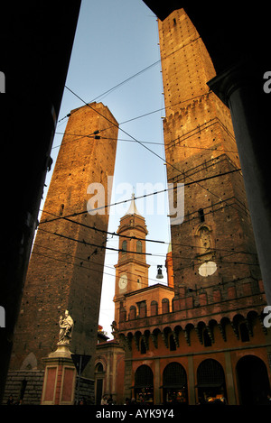 Bologna Emilia-Romagna Italy Statue of Saint San Petronius blessing the people of Bologna below the two towers upright vertical Stock Photo