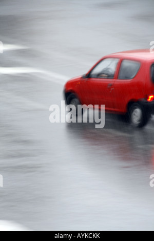 one abstract blurred fast car in rain
