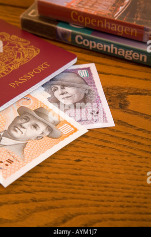 Copenhagen guide books with Danish Kroner and British passport Stock Photo