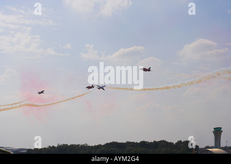 Red Arrows in double roll crossover at the Farnborough International Airshow 2006 Stock Photo