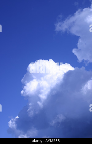 Blue sky background with white fluffy clouds Stock Photo - Alamy