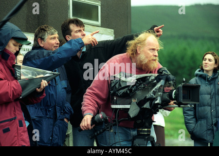 Film crew cameramen and directors filming action in a drama being filmed at Tower Colliery South Wales UK Stock Photo