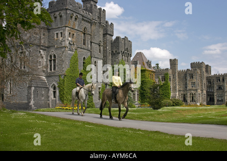 Horse riding in front of Ashford Castle Cong Co Mayo Ireland  Stock Photo