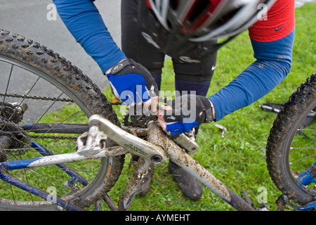 Close-up of cyclist repairing a broken chain during Mountain Bike trip in Yorkshire Dales, Great Britain Stock Photo