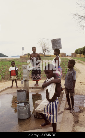 Villagers using a water pump in the village of Chembe,Cape Maclear, Lake Malawi, Malawi Stock Photo