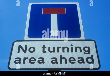 Close up of roadsign against clear blue sky showing No through road symbol with warning notice added No turning area ahead Stock Photo