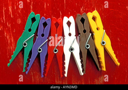 Multicolour multicolor Laundry clips on the red background Stock Photo