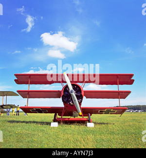 German Fokker Triplane replica Fok FI102 17 on a grass airfield at  UK EU in the 1970s Stock Photo