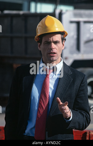 Portrait of a construction engineer on a job site talking to the camera Stock Photo