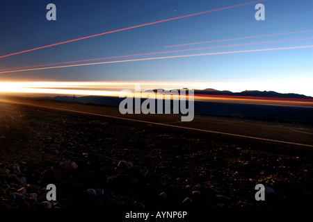 traffic trails in death valley,  California USA on route 190 at night Stock Photo