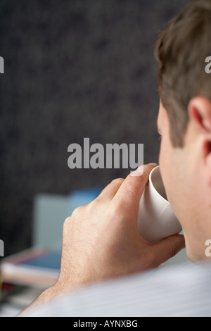 Businessman is drinking Stock Photo