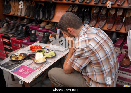 TURKISH MUSLIM MAN PRAYING BEFORE OPENING FASTING DURING THE RAMADAN Stock Photo