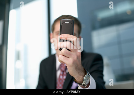 Businessman holding a mobile Stock Photo