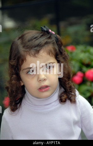 Three year old girl soft outdoor background Stock Photo