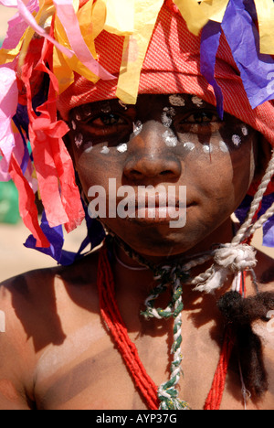 Boy dressed up as Hanuman the monkey god in bright colours and a painted face for the festival of Makar Sankranti.