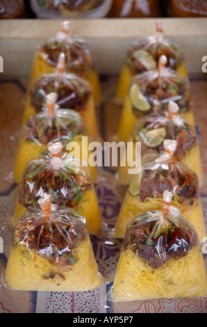 MALAYSIA Kedah Langkawi Cenang Night Market Curry Mee noodles with a curry sauce in clear plastic bags on a stall. Stock Photo