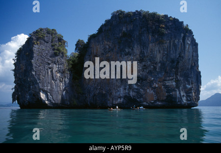 MALAYSIA Kedah Langkawi Island Archipelago Fishermen in boats beside one of many small islands off south coast of main island. Stock Photo