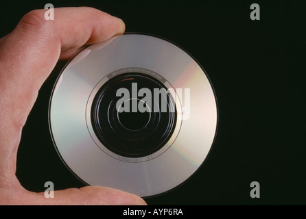 England Hand holding a CD single showing the recorded side Stock Photo