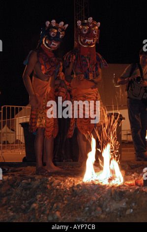 Buddhist monks performing a traditional fire ceremony at the Dalailama ...
