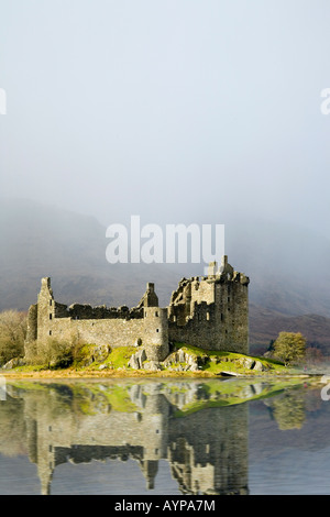 Scottish winter landscape with snow shower, over Kilchurn Castle, a ruined structure,  Loch Awe, Scotland  uk Stock Photo