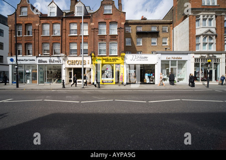 Shops and passers by in Kings Road London SW3 Stock Photo