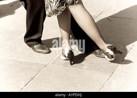 Street dancers performing tango dance Aged tone Copy space Stock Photo