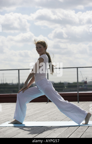 Blonde Woman Exercising Stock Photo - Alamy