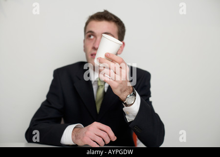 Businessman holding a cup in his hand, selective focus Stock Photo