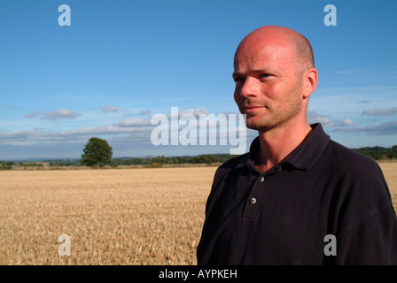 Portrait of a man with a bald head in a cornfield Stock Photo
