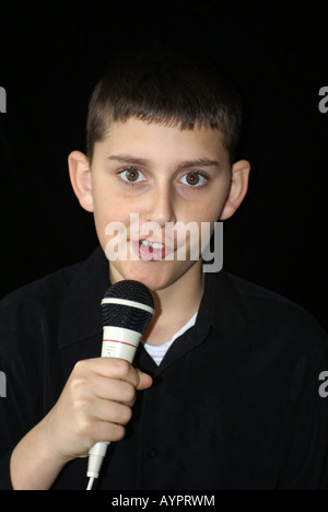 Child holding Microphone Stock Photo