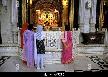 SUB74643 Devotees praying at Iskcon Hare Krishna temple Bombay Mumbai India Stock Photo