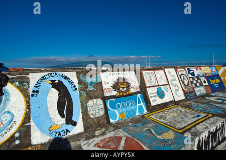 Colourful wall at the harbour in Horta and view of Pico Volcano, Faial, Azores, Portugal, Atlantic Ocean Stock Photo