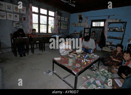 Tibetan handicapped children house near Dharamsala, Himachal Pradesh, India. Students painting and creating art in a classroom workshop. Stock Photo