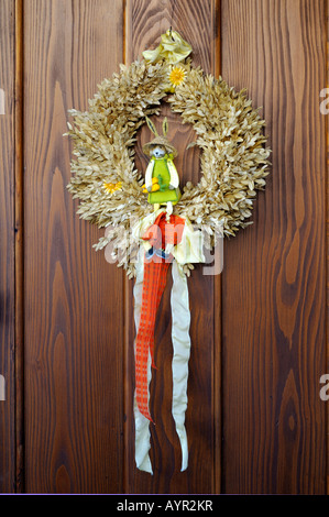 Wreath made of grain hanging on a door, Easter decoration Stock Photo