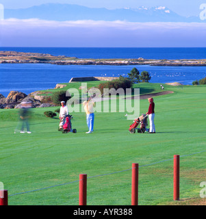 Victoria, BC, British Columbia, Canada - Seniors golfing on Golf Course at Victoria Golf Club overlooking Strait of Juan de Fuca Stock Photo