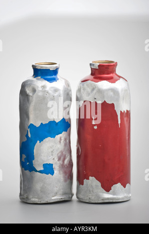 Worn, peeled aluminium bottles Stock Photo