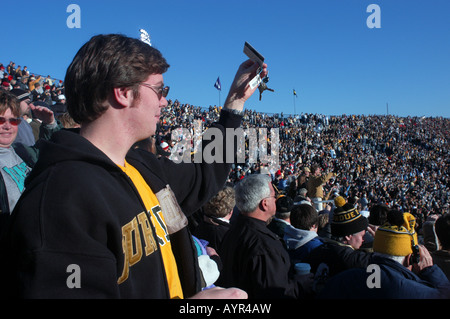 College student cheers at Purdue University football game crowd jingles keys in cheer West LaFayette Indiana USA college life ed Stock Photo