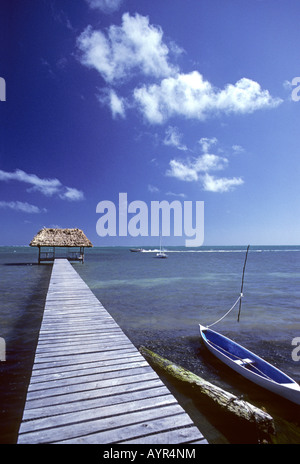 Dock beside a small boat on Caye Caulker, Belize, Central America Stock Photo