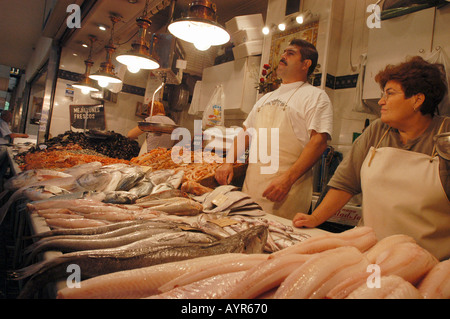 Vendors selling fresh seafood at the interiors of central market in Malaga Andalusia Spain. Stock Photo