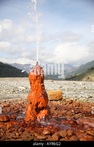 Mineral water spring staining the surrounding rocks rust colour. Jvari ...