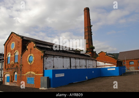 Building of old factory in Swansea Marina quarter with Flint Neil Partnership Consulting Engineers logo Swansea Wales UK Stock Photo