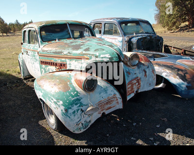 Old wrecked cars from the 1930s at a private junkyard in Bend, Oregon Stock Photo