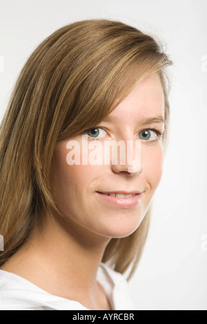 Headshot of young woman with long dark-blonde hair Stock Photo