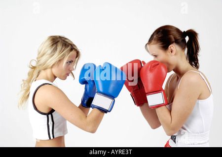 Two female boxers fighting each others Stock Photo